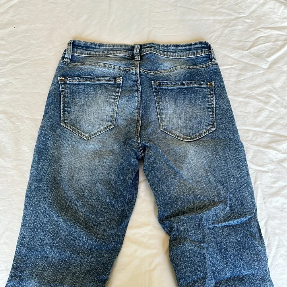Black Daisy jeans with gem embellishments and rips w/ silver lining 26.5” inseam